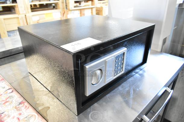 Black metal safe with digital keypad, no combination included. Item tag marked "118." Good condition, sturdy build.