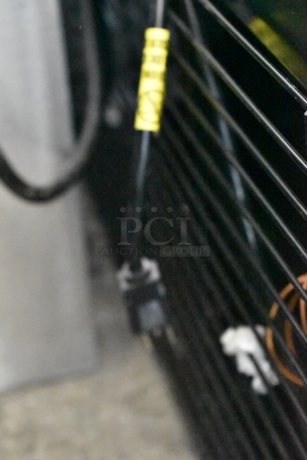 IDW metal commercial reach-in cooler, model G-26SI-C-3-3-4-B-5; single door, poly coated racks, 115V, 1 phase.