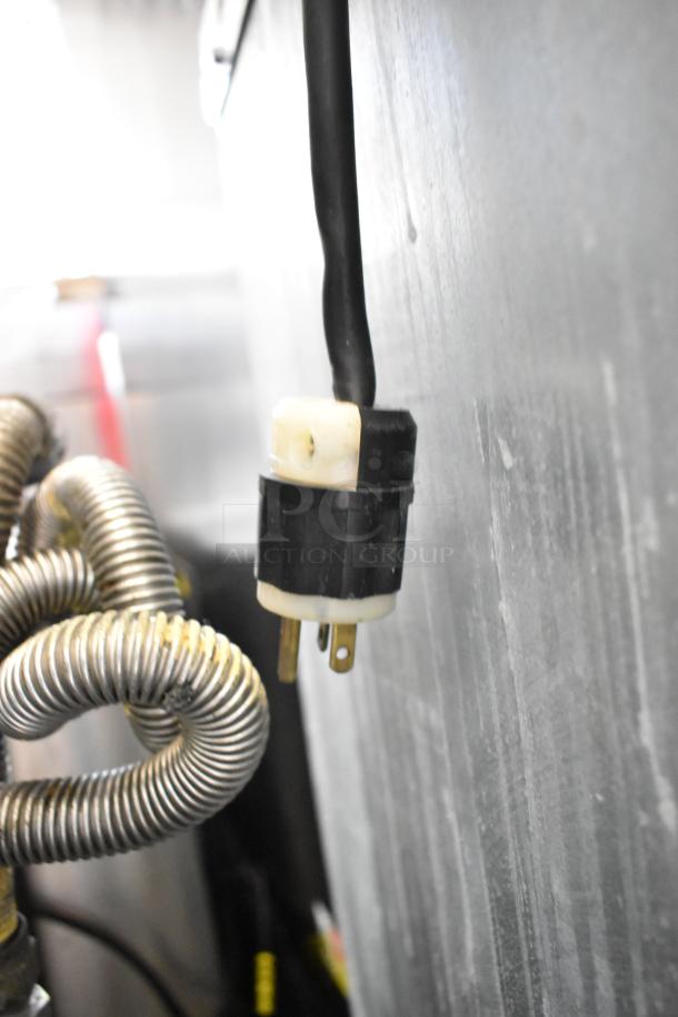 Hoshizaki KMD-410MAH commercial ice head, stainless steel, 115 volts, visible power cord, coiled metal tubing, on ice bin.
