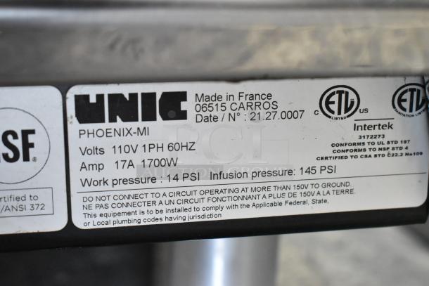 Unic Phoenix MI stainless steel countertop espresso machine, commercial grade, 110V, 14 PSI, made in France, model info tag visible.