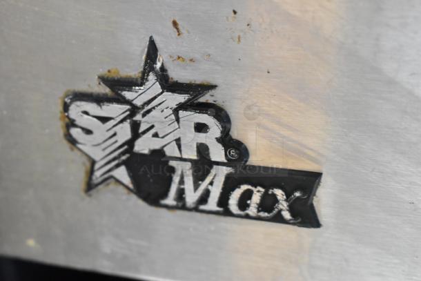 Star Max Stainless Steel Charbroiler Grill logo detail with minor surface wear, indicating commercial quality.