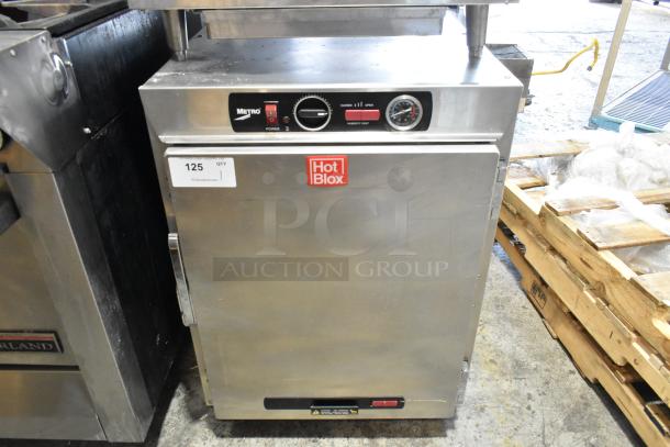 Metro HBCW8-AS-UC stainless steel heated holding cabinet on casters, 120 volts, 1 phase, with controls and Hot Blox label.