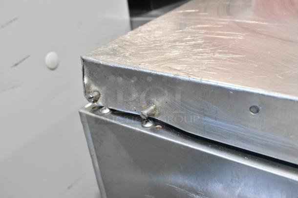 Turbo Air TPR-67SD-D4 stainless steel pizza prep table, 4 drawers, light wear on surface, commercial use, 115V, 1 phase.