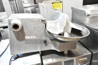 Hobart 84186 metal commercial countertop buffalo chopper with S blade, 115 volts, 1 phase. Used condition. Visible caution labeling.