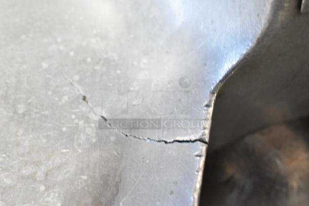 Cracked metal surface of Hobart 84186 Buffalo Chopper. Visible wear, potential impact on functionality.
