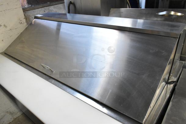 Avantco 178SSPT60MHC stainless steel sandwich salad prep table with closed top, on commercial casters, 15V, 1 Phase.