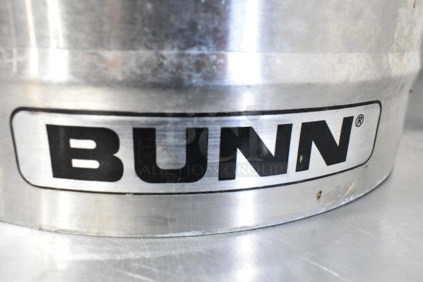 Bunn ICD-3 stainless steel beverage holder dispenser, visible Bunn logo, slight wear on the surface.