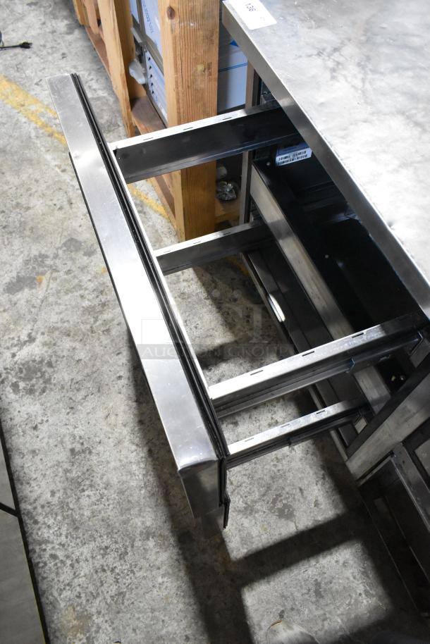 Turbo Air TPR-44SD-D2 stainless steel pizza prep table with two drawers on casters, shown in open position.