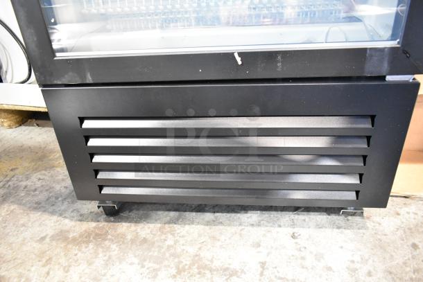 KoolMore KM-MDF-1GD-12C metal commercial freezer, single door, scratch and dent condition, 115 volts, on casters.