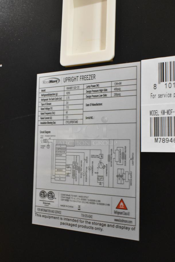 BRAND NEW KoolMore KM-MDF-1GD-12C commercial freezer tag, indicating specs: 115V, 1 Phase, scratch and dent condition.