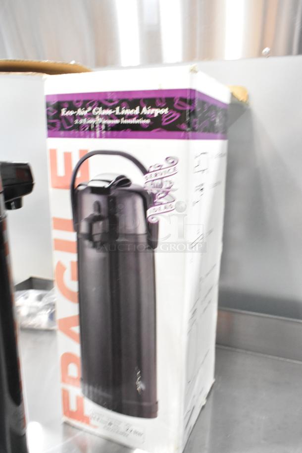 BRAND NEW IN BOX! ECAL22PBLK Air Pot, 2.2-liter, glass-lined, eco-air vacuum insulation, black finish. Box labeled "FRAGILE."