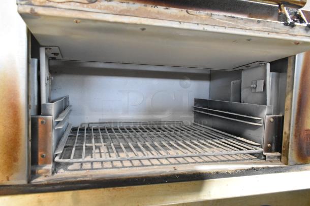 Vulcan VIR1CF stainless steel gas vertical upright broiler with convection oven, commercial casters, visible interior detailing.