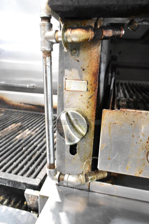 Vulcan VIR1CF stainless steel vertical broiler with convection oven, showcasing rustic piping and gas valve. Signs of wear visible.