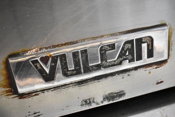 Vulcan VIR1CF logo on stainless steel surface. Visible dirt and wear suggest use.