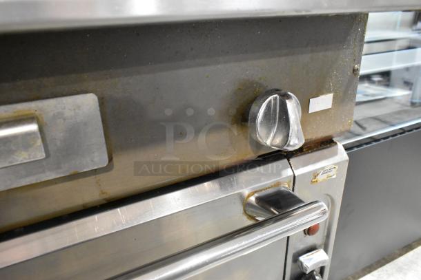 Vulcan VIR1CF stainless steel gas broiler with convection oven, commercial casters. Shows control dial and handle. Used condition.