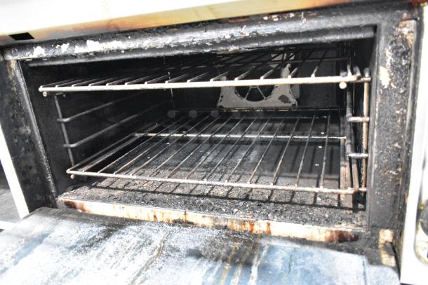 Vulcan VIR1CF stainless steel commercial gas broiler with convection oven; used, showing interior condition with racks and signs of wear.