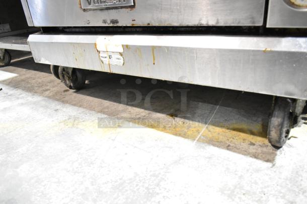Vulcan VIR1CF stainless steel upright broiler with convection oven on commercial casters, showing signs of wear and stains.