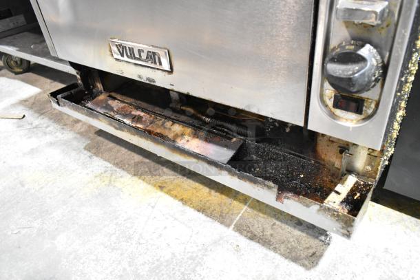 Vulcan VIR1CF stainless steel gas broiler with convection oven. Visible wear and residue, featuring control panel and Vulcan logo.