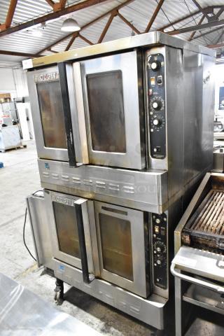 Blodgett stainless steel convection ovens, view-through doors, metal racks, thermostatic controls, on commercial casters.