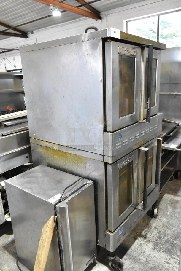 Blodgett stainless steel convection ovens with view-through doors, metal racks, thermostatic controls, on commercial casters.