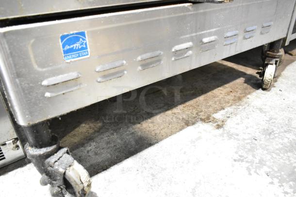 Blodgett stainless steel commercial convection ovens with view-through doors, metal racks, thermostatic controls, and casters. Energy Star label visible.