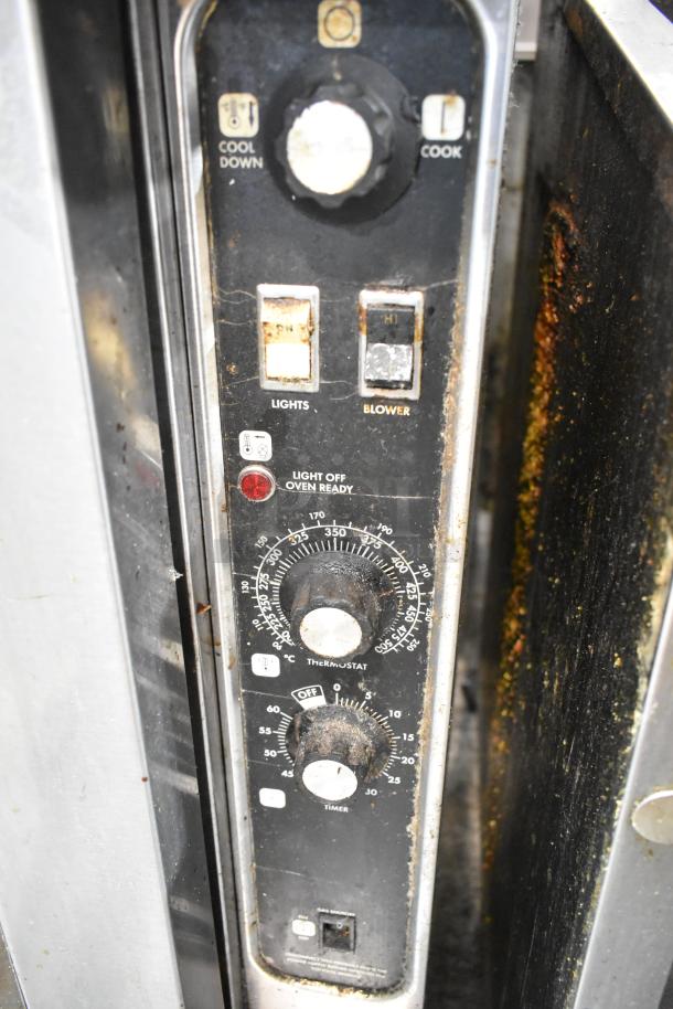 Blodgett convection oven control panel with visible buttons and dials, including thermostatic controls and timer, showing wear.
