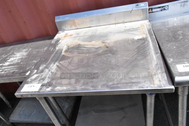 John Boos stainless steel table with metal under shelf, visible wear and scratches, tag labeled "179%".