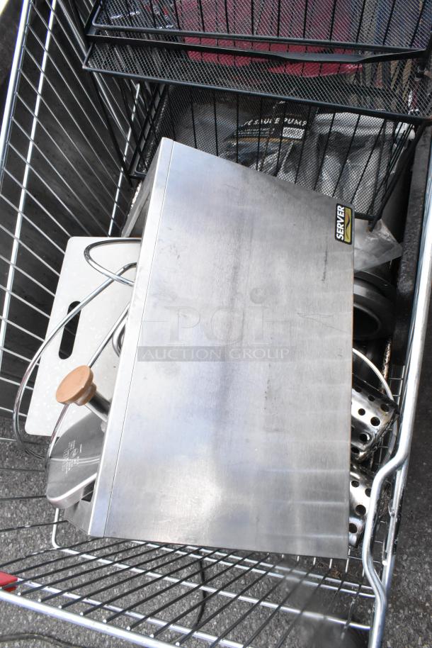 Shopping cart with metal baking pans, cup dispenser, and topping bin. Features include Server brand marking. Used condition.