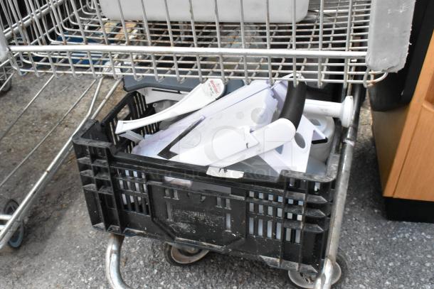Shopping cart containing vegetable slicer pieces and bar mats, in used condition. Includes black plastic crate.