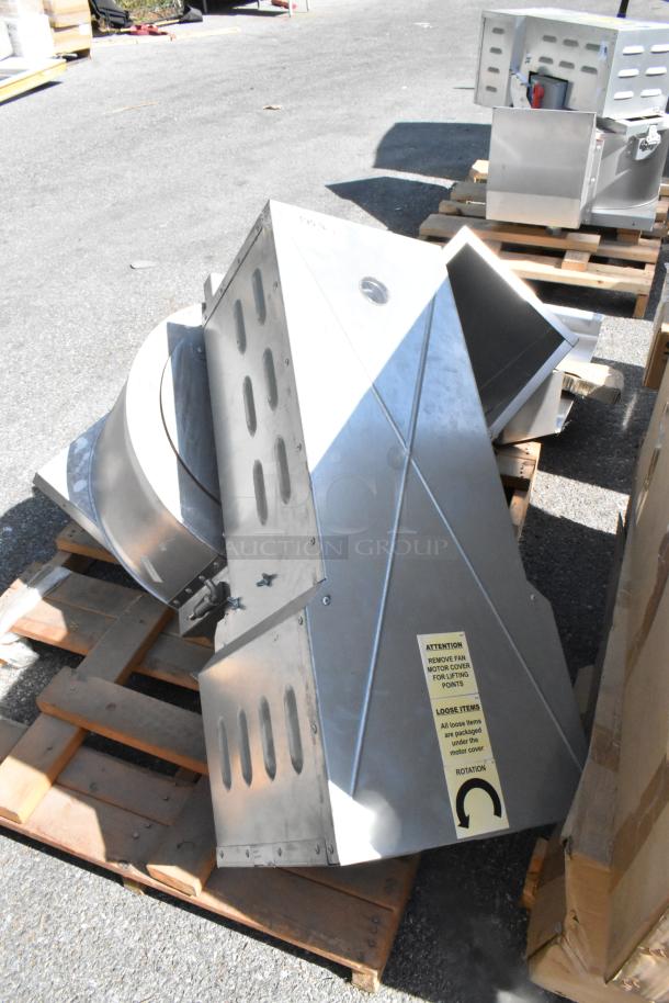 2021 CaptiveAire CASRE13BD metal commercial power ventilator on pallets, silver, with label instructions for handling.