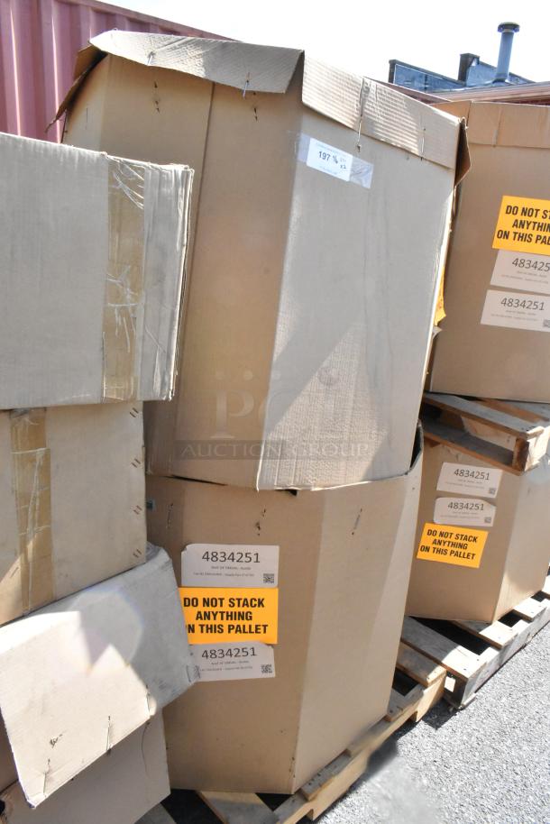 Brand new CaptiveAire DMUA18FA rooftop exhaust fans, sealed in boxes on pallets; labels warn "Do not stack."