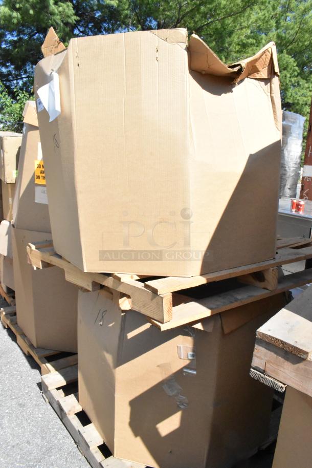 Two boxes containing brand new CaptiveAire DMUA18FA metal rooftop exhaust mushroom fans, on a wooden pallet.
