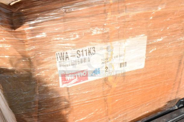 23 new boxes of Metro IWA-S11K3 SmartWall Slanted Lid Holder/Drying Shelf, wrapped in plastic.