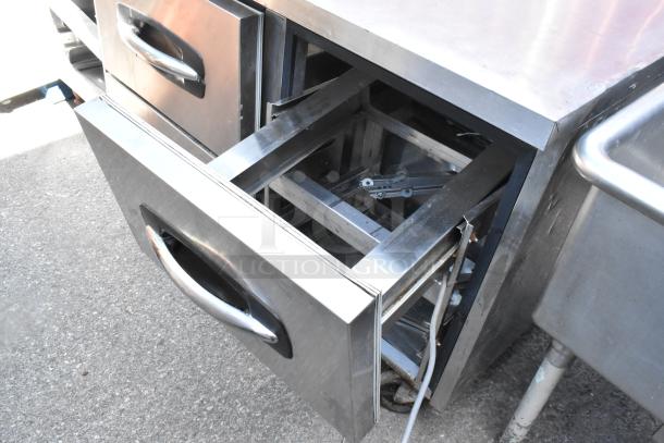 Norlake UR72 stainless steel 6-drawer undercounter cooler on casters, 115 volts, 1 phase, open drawer view.