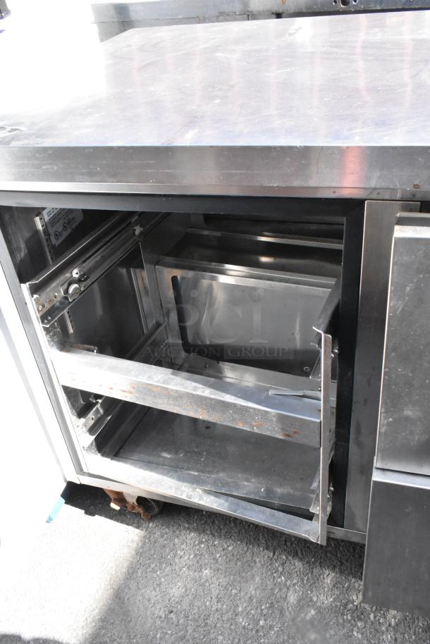 Norlake UR72 stainless steel undercounter cooler, 6 drawers, on commercial casters. Visible wear, 115V, 1 phase.