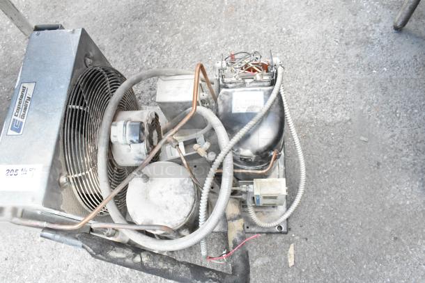 Copeland REK3-0125-PFV-959 compressor, 208/230V, 1 phase, used, visible wiring and components, Copeland quality label.