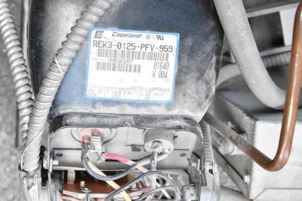 Copeland REK3-0125-PFV-959 compressor, 208/230V, 1 Phase. Label shows model, serial number 98836207, and wiring details.