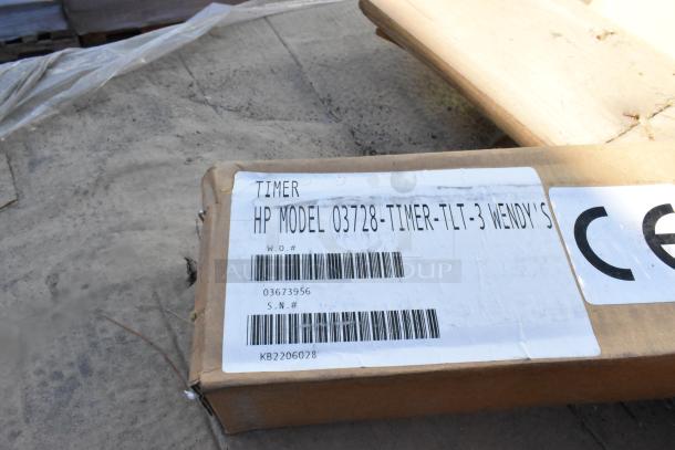 Cardboard box with label showing "Timer HP Model 03728-TIMER-TLT-3," part of 11 new boxes of emergency lights, timers.