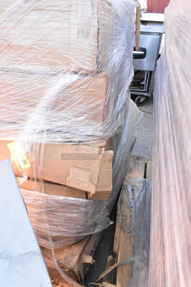 11 sealed boxes on pallets, wrapped in plastic. Boxes contain new emergency lights and timers.