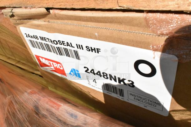14 boxes of Metro 2448NK3 wire shelves, new condition. Labels show "24x48 Metroseal III SHF" and quantity 4 per box.