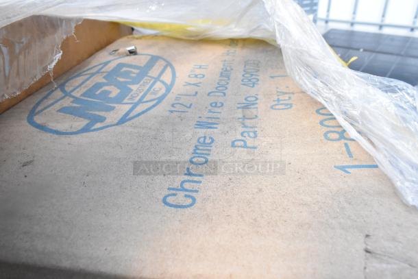 Box of Nexel DH8 Chrome Wire Document Holders, 12"x8", Part No. 489753, new condition, visible under plastic wrap.
