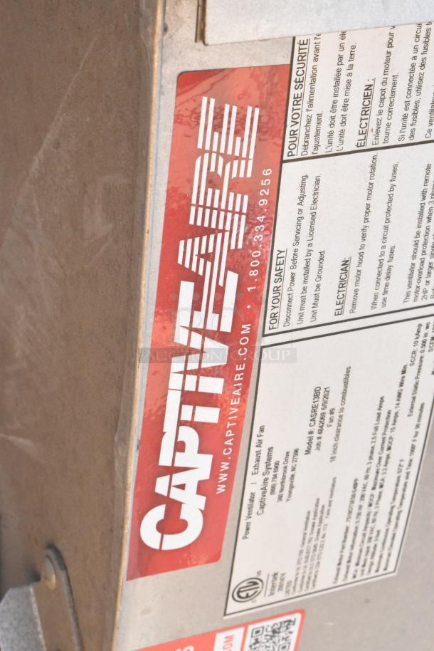 2021 CaptiveAire CASRE13BD metal commercial power ventilator with visible label, model details, and safety instructions.