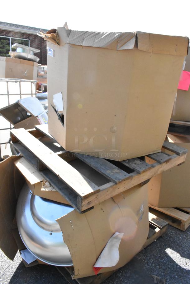2 new CaptiveAire DMUA18FA rooftop exhaust fans in boxes on a pallet. Boxes slightly worn.