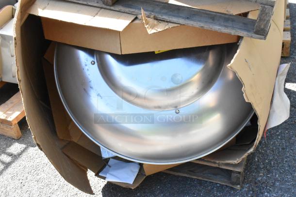 Brand new CaptiveAire DMUA18FA metal rooftop exhaust mushroom fan partially visible in damaged packaging.