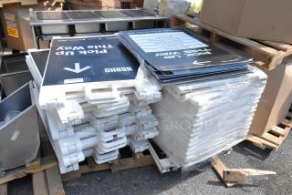 Stack of 20 A-frame sidewalk signs in white plastic, featuring "Pick Up This Way" text. Signs appear new and wrapped.