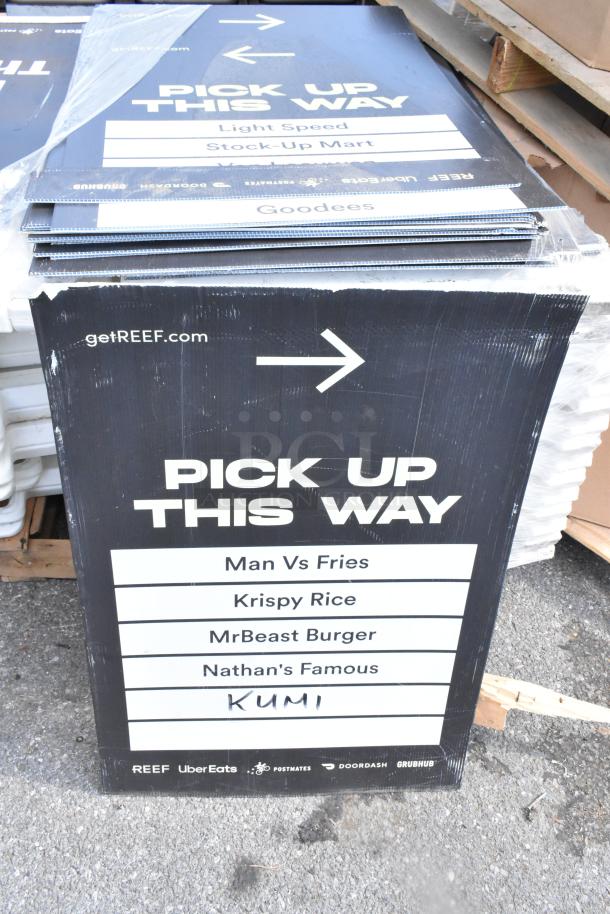 Stack of 20 A-frame sidewalk signs with "Pick Up This Way," featuring brands like MrBeast Burger; signs are slightly worn.