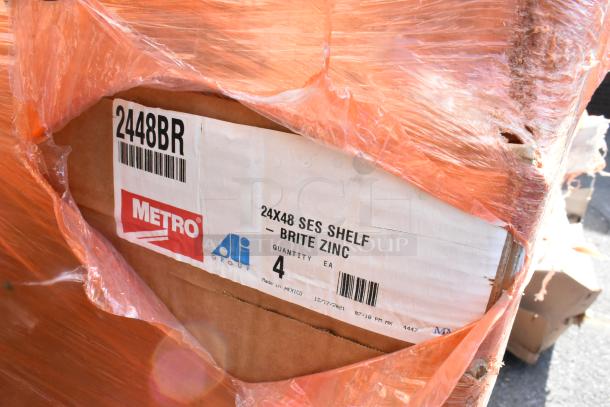 14 brand new boxes of Metro 2448B shelves, model 2448BR, brite zinc, 24x48, wrapped in orange plastic, Made in Mexico.