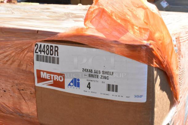 16 new Metro 2448BR shelves in boxes. Labels show "24x48 SES Shelf - Brite Zinc," quantity 4 per box.