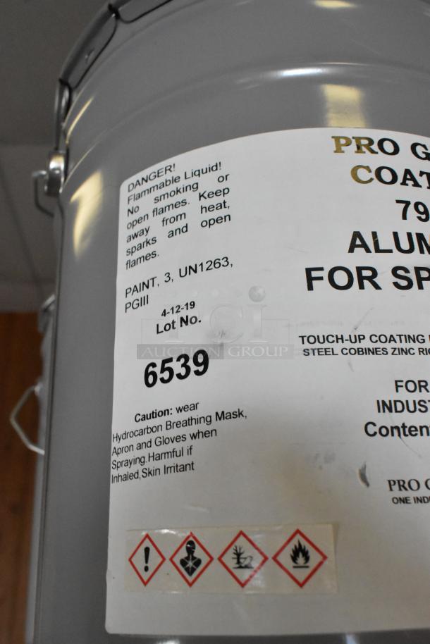 Pro Guard Chemicals drum with warning labels, including flammable liquid caution. Lot No. 6539, for spray application.