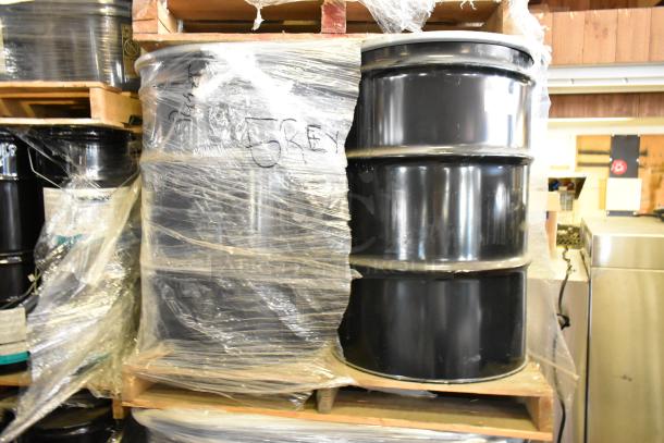 Four Pro Guard chemical barrels, including 55-gallon gray EPDM liquid rubber, wrapped and labeled "Grey."